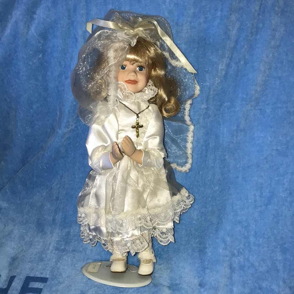 porcelain collectors doll with cross 16” tall with stand vintage